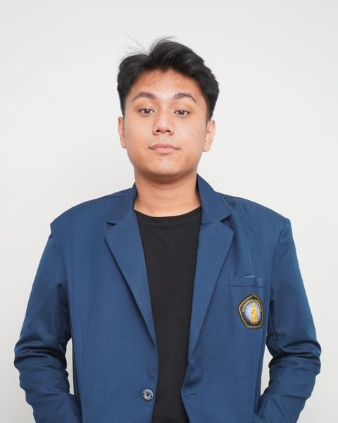 Portrait of Reyno Benedict wearing the navy Universitas Brawijaya almamater jacket with the university badge